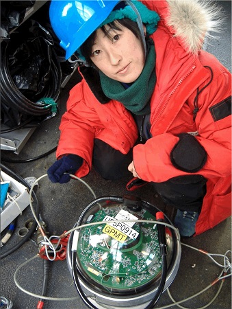 One of the researchers setting up the Digital Optical Module at IceCube at the South Pole